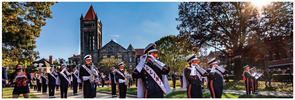 Illininois marching band students preforming in front of Altgeld Hall